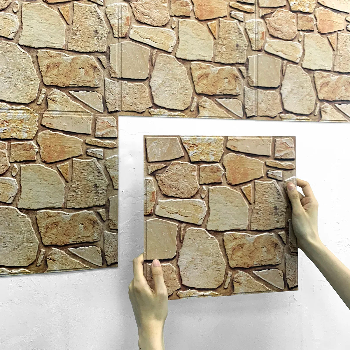 Peel and Stick Wall Kit tiles being applied by hand, Everstock Goods