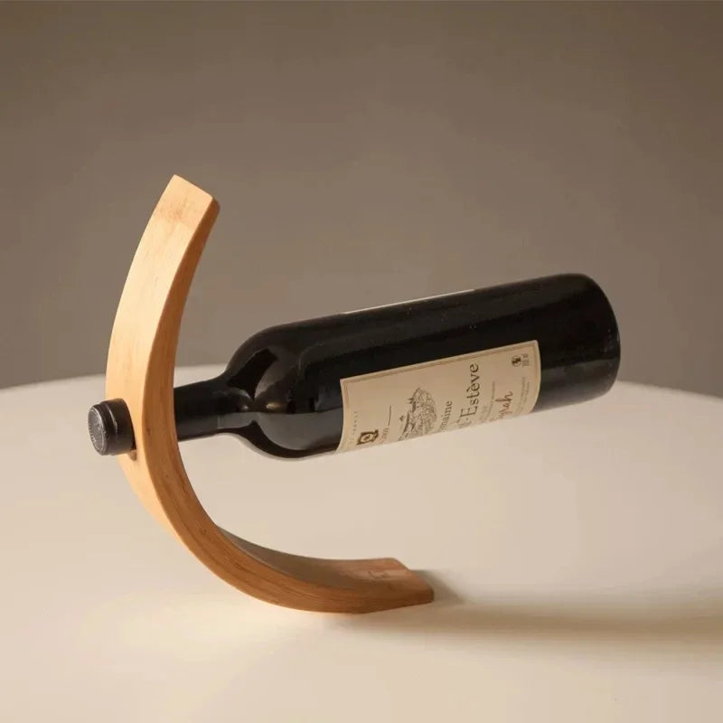 Gravity Bottle Stand balancing a full wine bottle by Everstock Goods